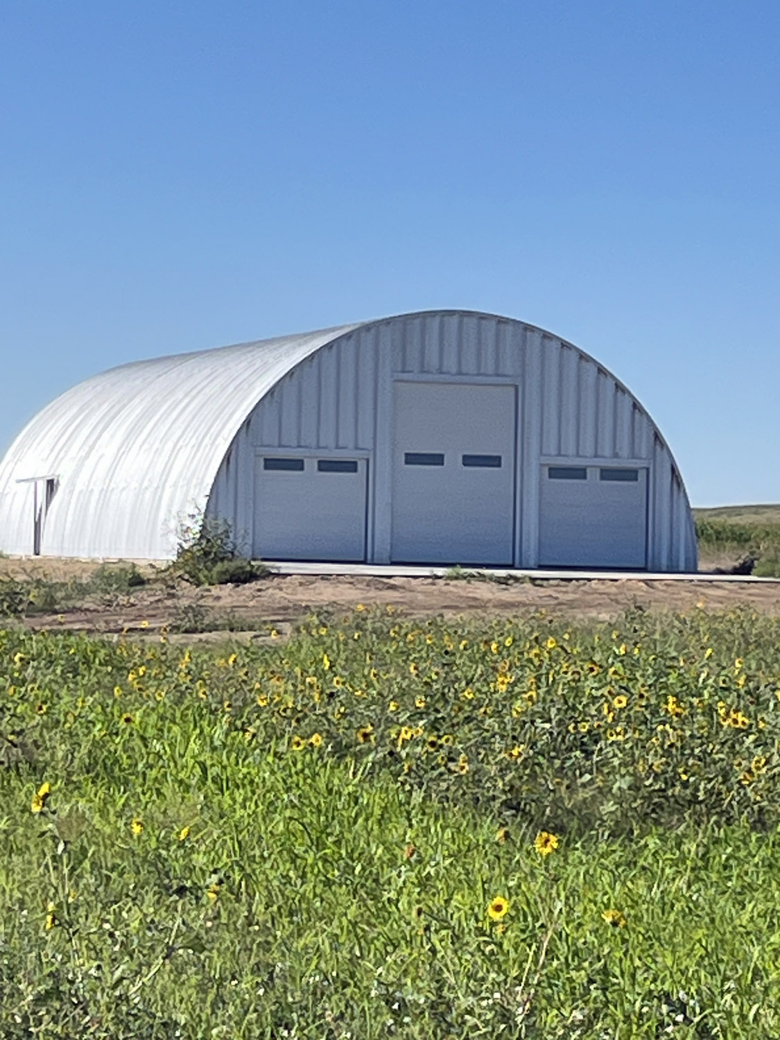 Arch recreation storage building with 3 varying size door heights